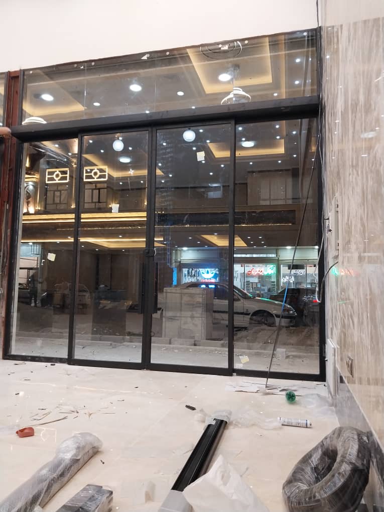 درب اتوماتیک مجتمع تجارت آسانسور